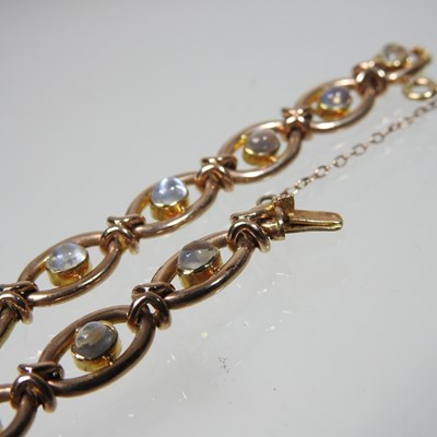 Lot 38 - A 15 carat gold and moonstone fancy link...