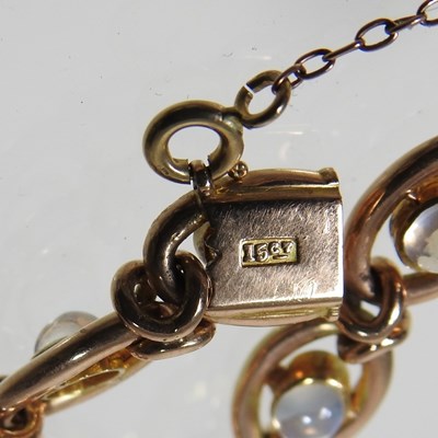 Lot 38 - A 15 carat gold and moonstone fancy link...
