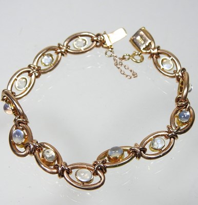 Lot 38 - A 15 carat gold and moonstone fancy link...
