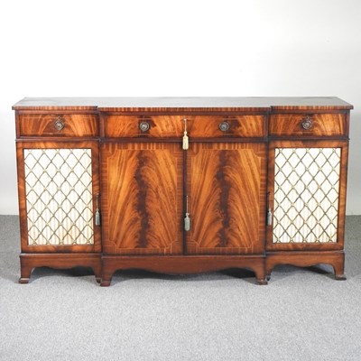 Lot 410 - A reproduction mahogany break front sideboard,...