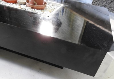 Lot 18 - An Italian black formica Alveo coffee table,...