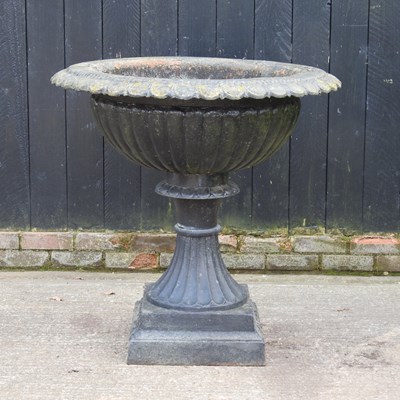 Lot 35 - A large black painted cast iron garden planter,...