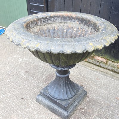 Lot 35 - A large black painted cast iron garden planter,...