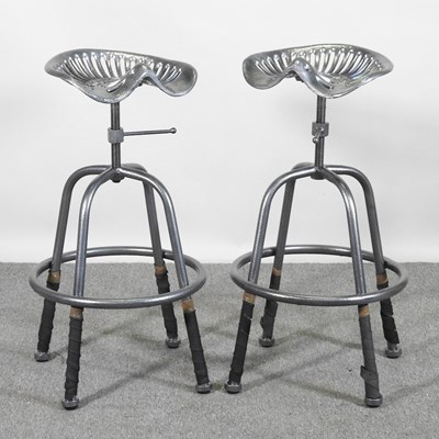 Lot 471 - A pair of metal painted tractor seat bar...