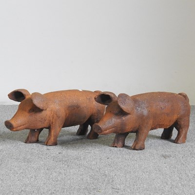 Lot 530 - A pair of rusted metal models of pigs