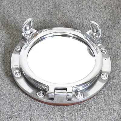Lot 467 - A novelty mirror, in the form of a ship's...