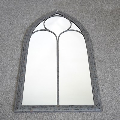 Lot 568 - A wide arched outdoor mirror, 112cm high