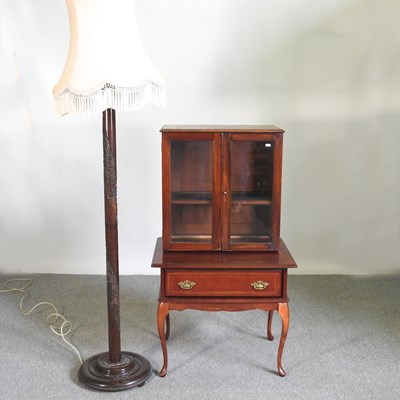 Lot 438 - An early 20th century glazed cabinet on stand,...