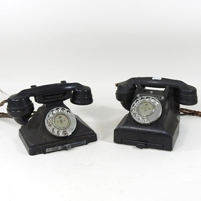 Lot 479 - A vintage black bakelite telephone, together...