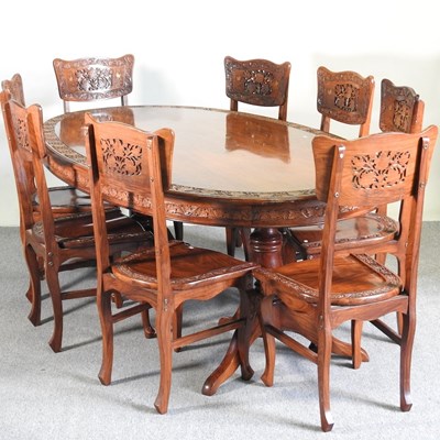 Lot 437 - An Indian brass inlaid hardwood dining table,...