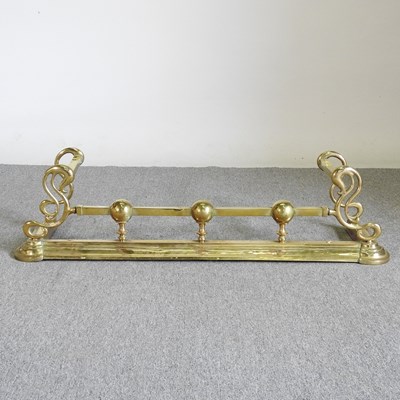 Lot 454 - An Art Nouveau brass fender