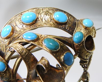 Lot 29 - A 19th century gilt and turquoise brooch, of...