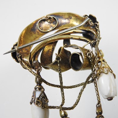 Lot 29 - A 19th century gilt and turquoise brooch, of...
