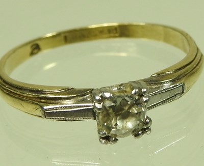Lot 41 - An 18 carat gold and platinum set single stone...