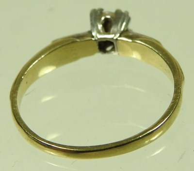 Lot 41 - An 18 carat gold and platinum set single stone...