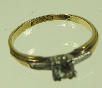 Lot 41 - An 18 carat gold and platinum set single stone...
