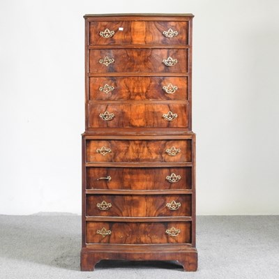 Lot 297 - A 1930's walnut tallboy chest, on bracket feet