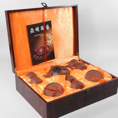 Lot 448 - A Chinese redware tea set, in a lacquered case,...