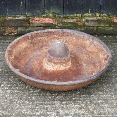 Lot 306 - A cast iron circular pig trough, 70cm diameter
