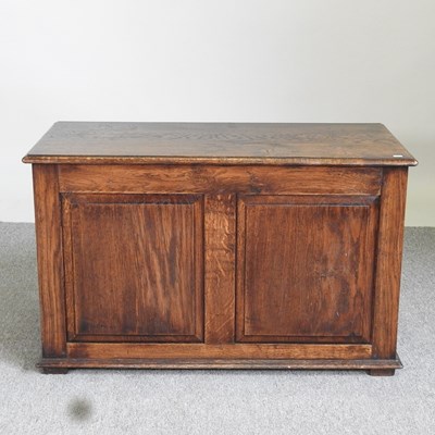 Lot 434 - An early 20th century oak chest, with a hinged...