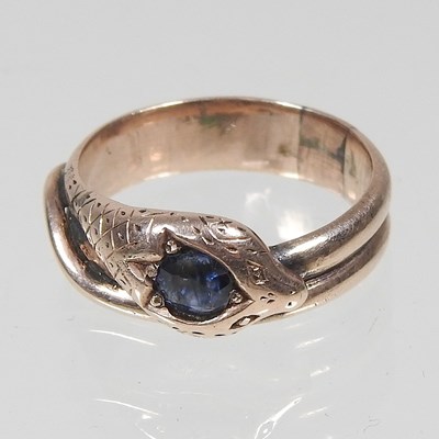 Lot 376 - A sapphire ring, in the form of a coiled snake,...