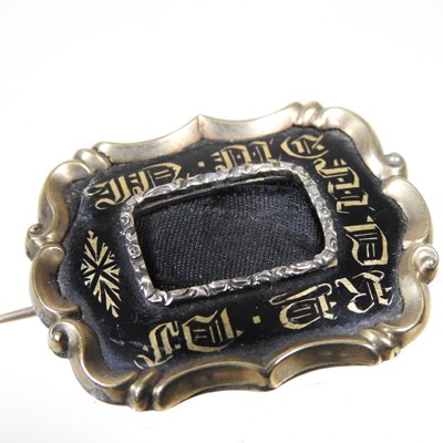 Lot 43 - A Victorian enamelled mourning brooch, with a...