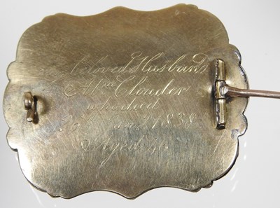 Lot 43 - A Victorian enamelled mourning brooch, with a...