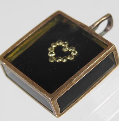 Lot 43 - A Victorian enamelled mourning brooch, with a...