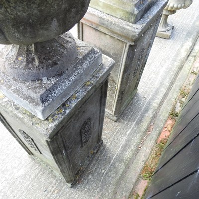 Lot 11 - A pair of large cast stone garden urns, each...