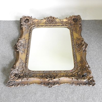 Lot 545 - A large modern gilt framed wall mirror, with a...