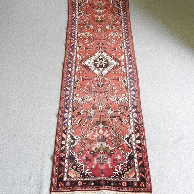 Lot 405 - A Persian Hamadan runner, with central...