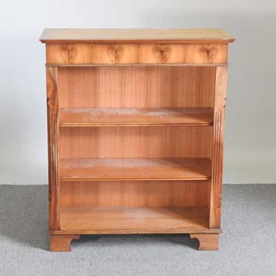 Lot 567 - A reproduction yew wood dwarf open bookcase