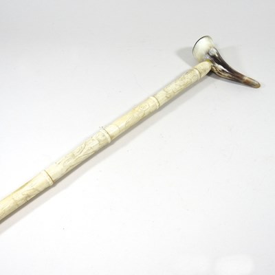 Lot 548 - A carved bone sectional walking stick, with a...
