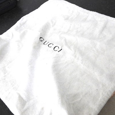 Lot 19 - A Gucci black leather tote handbag, with...