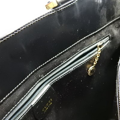 Lot 19 - A Gucci black leather tote handbag, with...