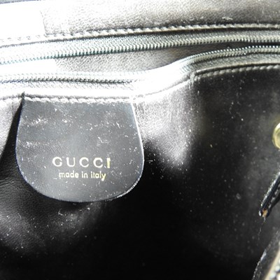 Lot 19 - A Gucci black leather tote handbag, with...