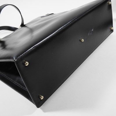 Lot 19 - A Gucci black leather tote handbag, with...