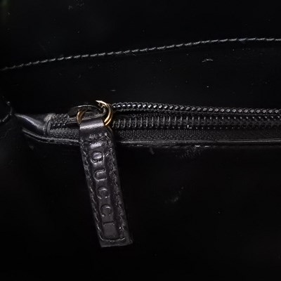 Lot 19 - A Gucci black leather tote handbag, with...