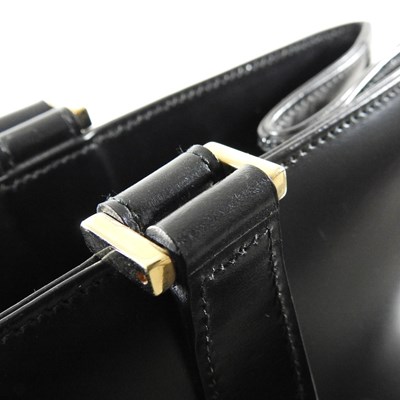 Lot 19 - A Gucci black leather tote handbag, with...