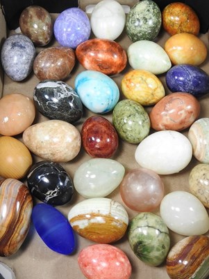 Lot 13 - A collection of various polished hardstone eggs