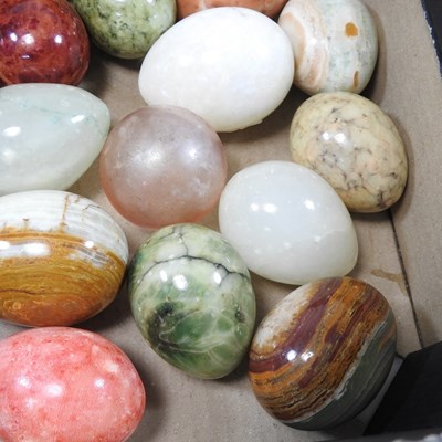 Lot 13 - A collection of various polished hardstone eggs