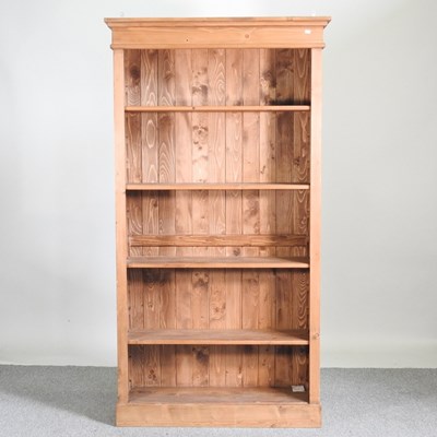 Lot 369 - A modern pine standing open bookcase, on a...