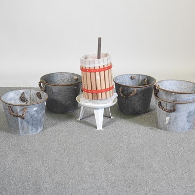 Lot 412 - A metal fruit press, 58cm high, together with...