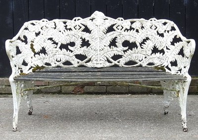 Lot 10 - An ornate white painted cast iron...