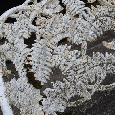 Lot 10 - An ornate white painted cast iron...
