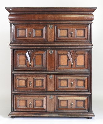 Lot 15 - A large late 17th century oak chest, in two...