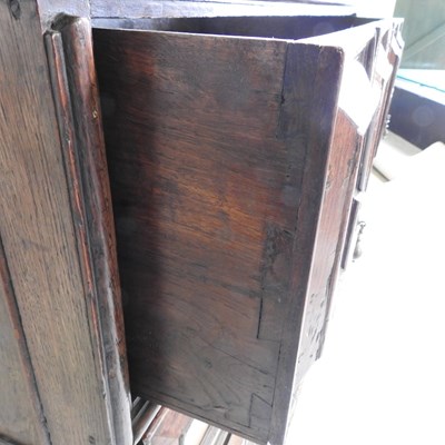 Lot 15 - A large late 17th century oak chest, in two...
