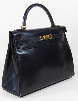Lot 55 - An Hermes Kelly handbag, 2000, in black...