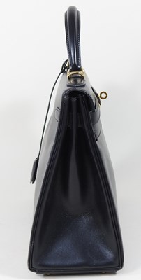 Lot 55 - An Hermes Kelly handbag, 2000, in black...