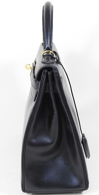 Lot 55 - An Hermes Kelly handbag, 2000, in black...